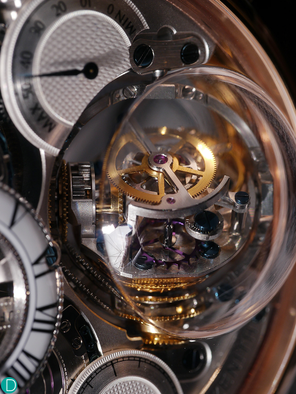 The gymbal system, which Zenith calls the gyroscope allows the escapement to keep a horizontal position regardless of the position of the case.