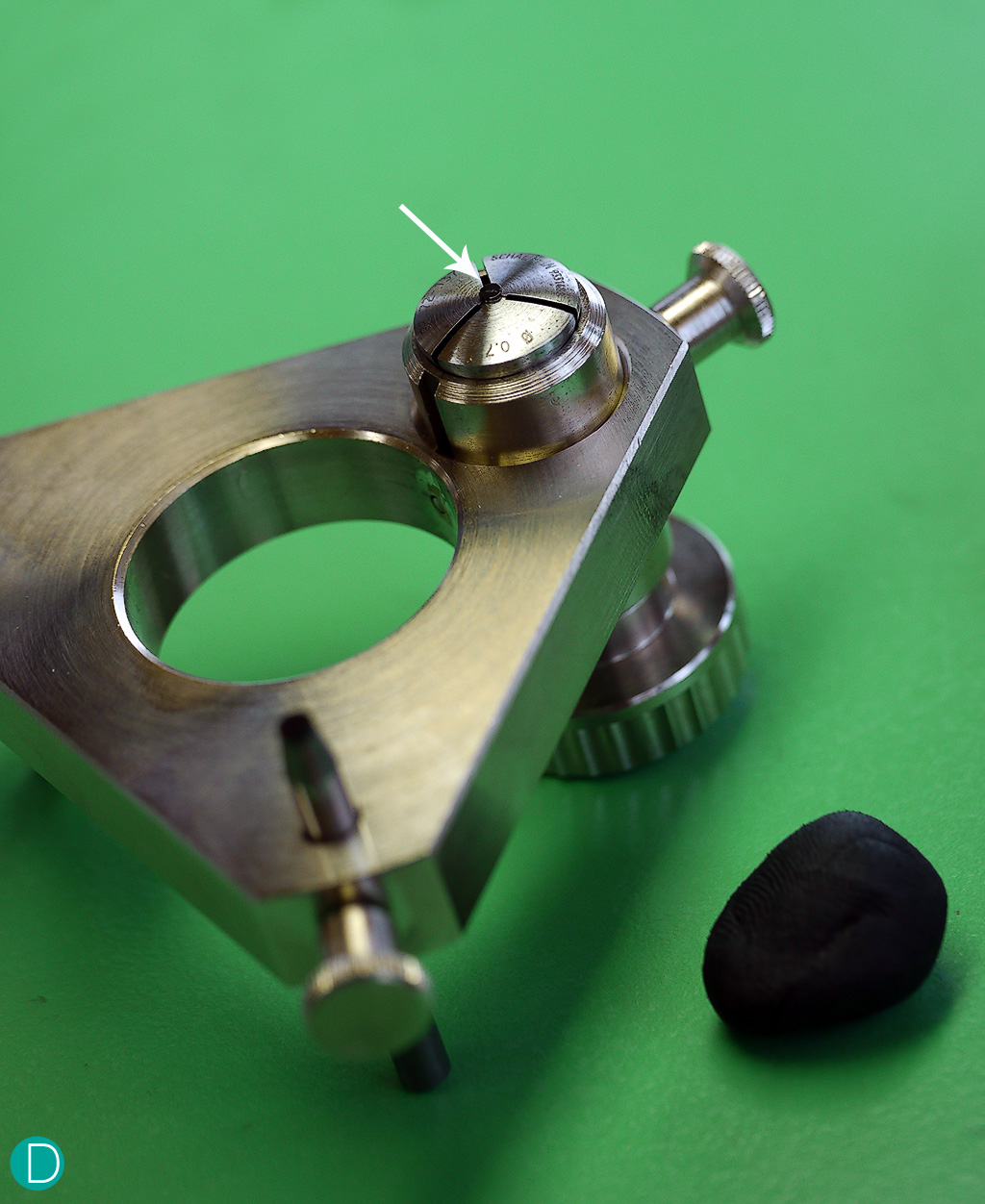 Even the tools used to hold the components are made in-house in Greubel-Forsay.In the photograph, the tripod tool is used to hold one single screw securely. The tripod legs are used to ensure the top of the screw which is the target for polishing is perfectly level, before the manual polishing process begins.