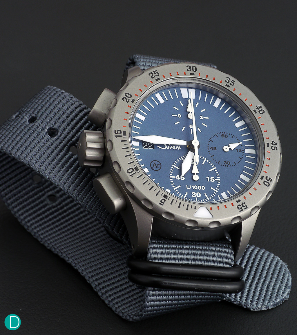 Sinn U1000. Chronograph with center minute totalizer using the Sinn movement SZ02, which is temperature resistant from 45 °C up to + 80 °C, and a special sealing of the push pieces and crown to enable operation of the chronograph while diving.
