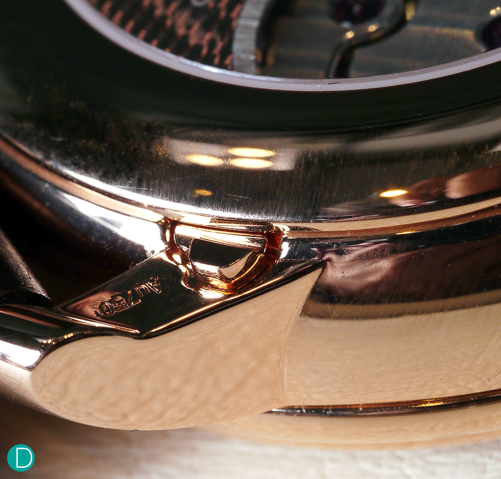 Detail of the lug, showing one of the moonphase corrector pushers.