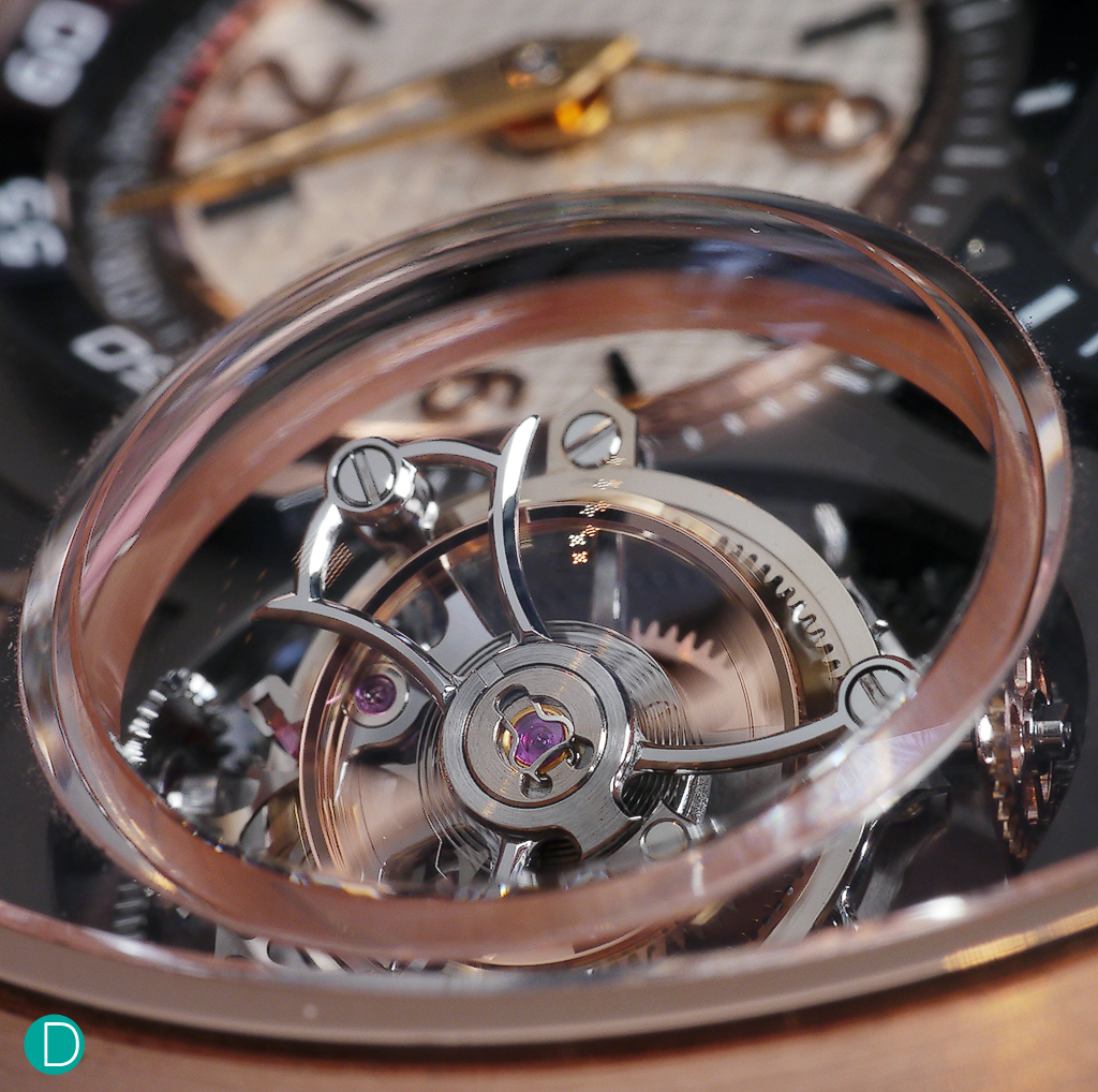 A close up shot on the Tri-Axial Tourbillon. To accomodate the tourbillon, which eventually traces all the points of a sphere, the sapphire crystal accomodates a domed surface.