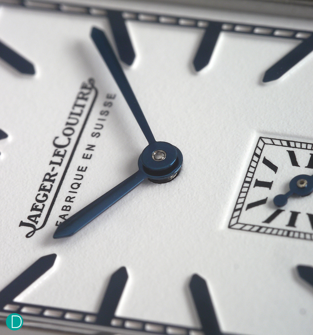 Detail of the JLC dial. The silvered grain dial has a texture of writing paper and contrasts beautifully with the blued applique indices and blued steel hands.