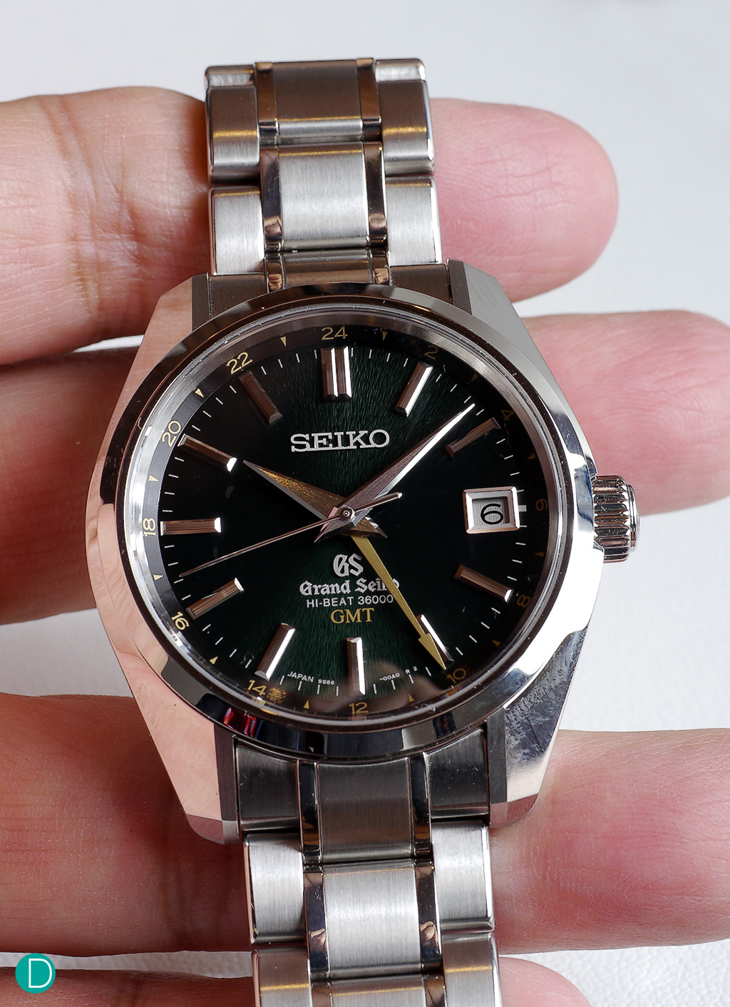The Grand Seiko SBGJ003. This one comes in black dial, and featuring a red "GMT" hand. 