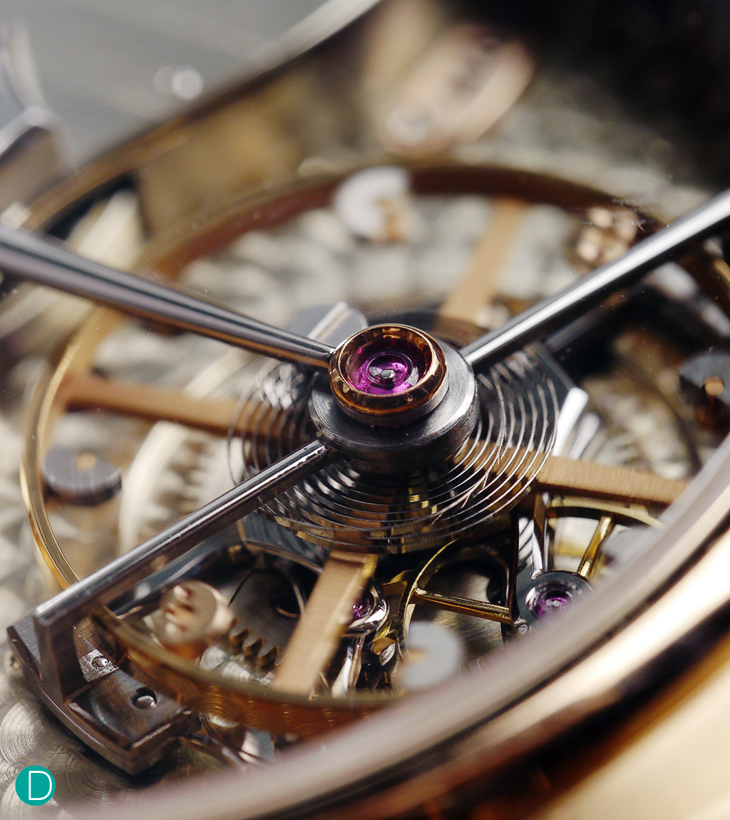 The tourbillon cage is attached to the cock, running on a ruby with  a rose gold chaton. The cage is very light and entirely made by hand.
