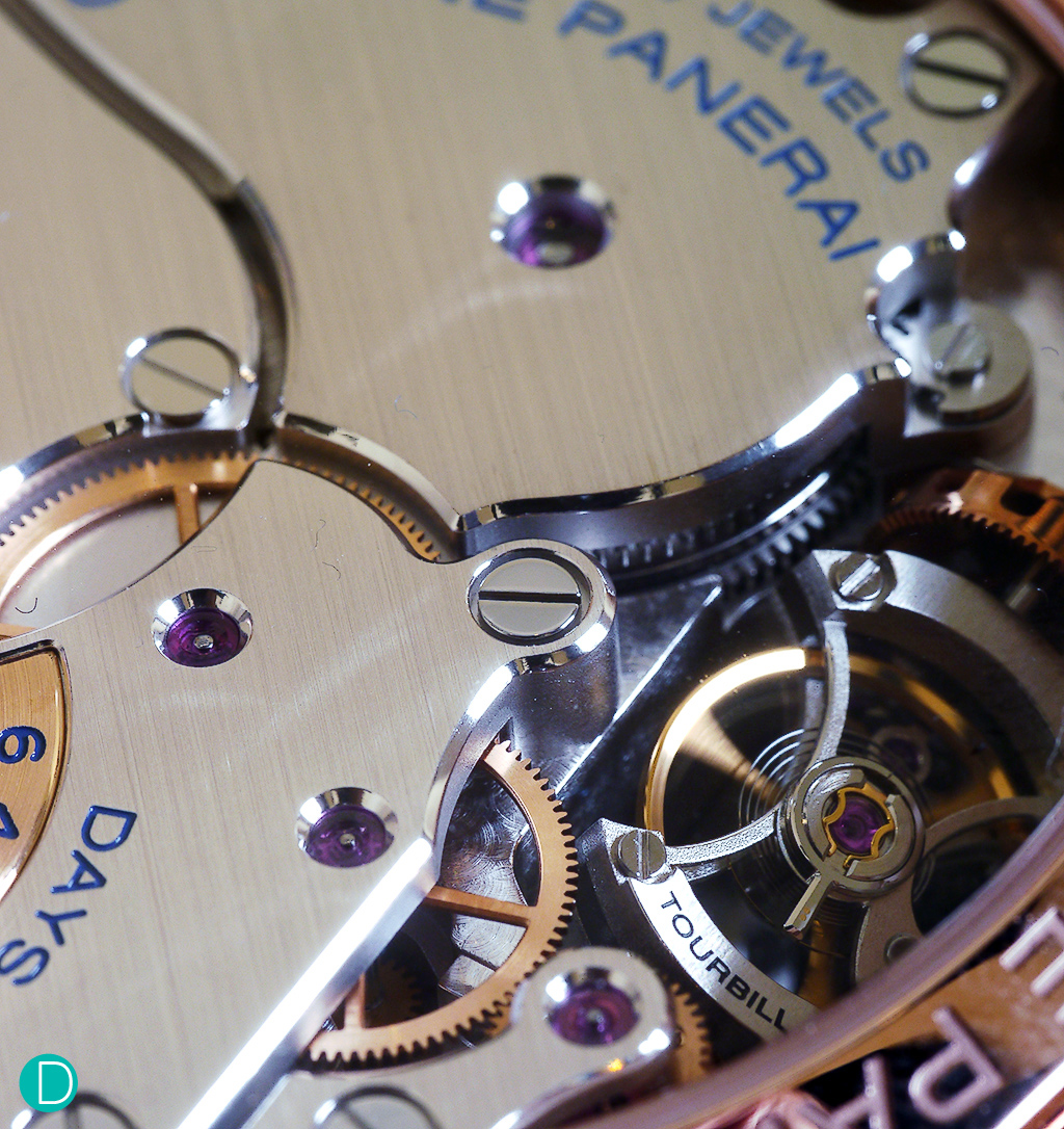 This tourbillon is rather different; the cage and escapement rotates on an axis that is perpendicular to the balance, unlike the usual which rotates parallel to it.