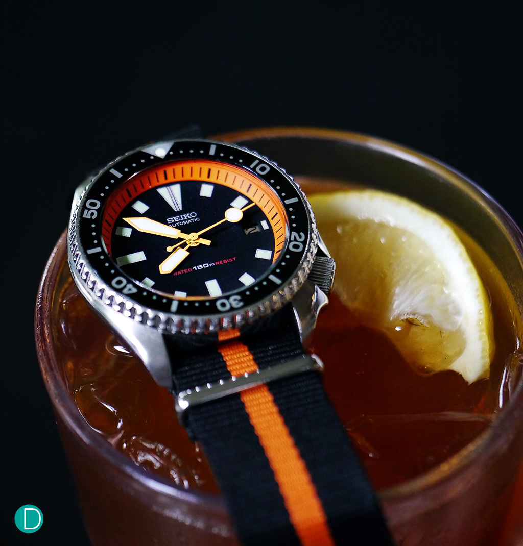 Water Resistant to 150m, another Seiko diver in orange.