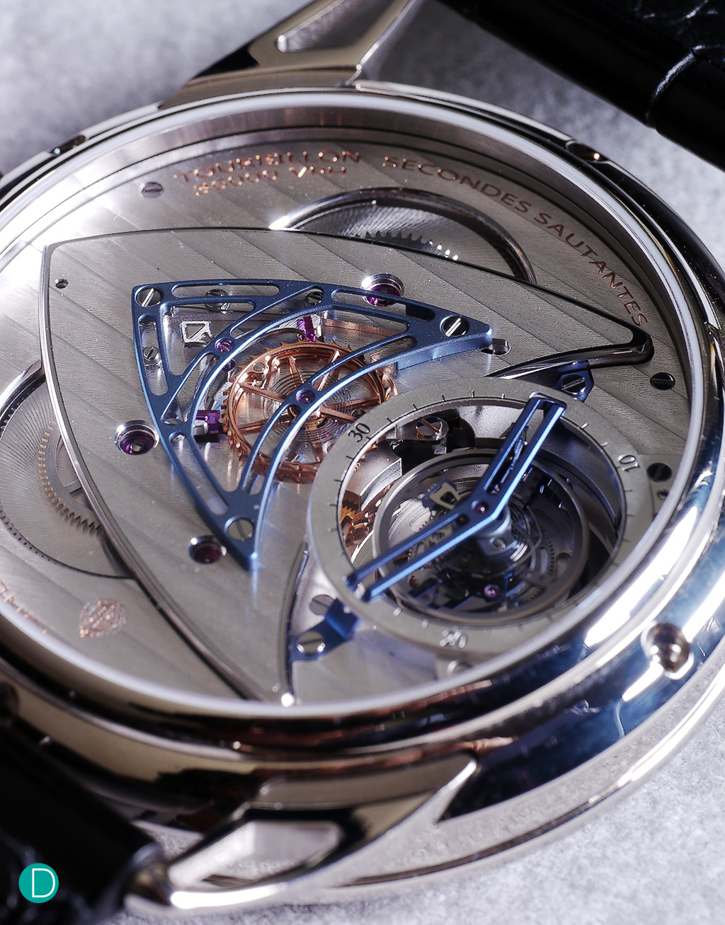 DB25T movement is the DB2019. Magnificently laid out to look like a shield, with blued titanium bridges holding the 30 second tourbillon and the jumping seconds wheel.