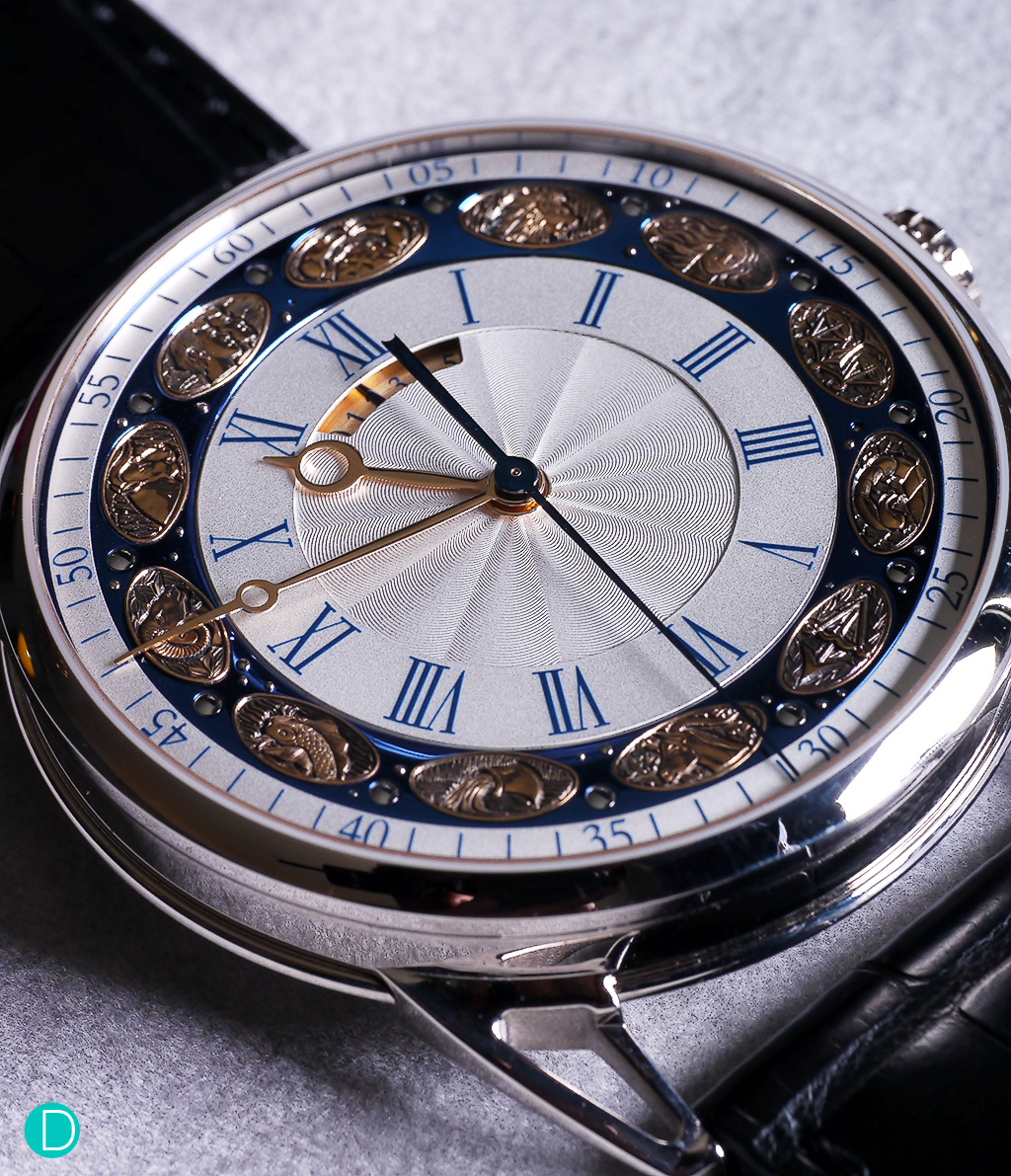 De Bethune DB25T Zodiac. The watch indicates the time in hours, minutes and seconds. And features a rather special applique on the dial representing the 12 zodiac signs. 