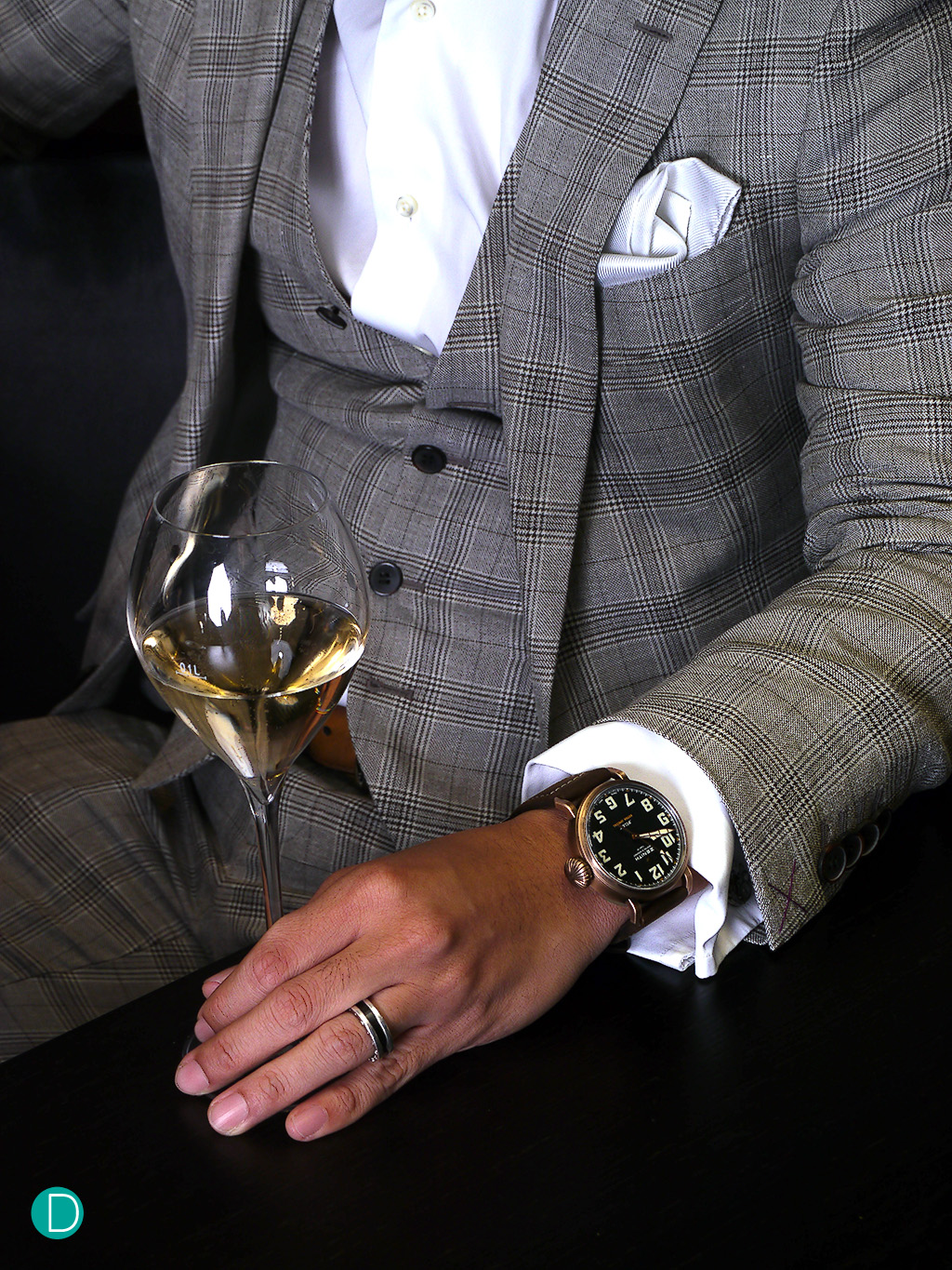 Seen here on Charle's wrist, the Bronze Extra Special adds a finishing touch to the Prince of Wales fabric, and sits comfortably with french cuffs.