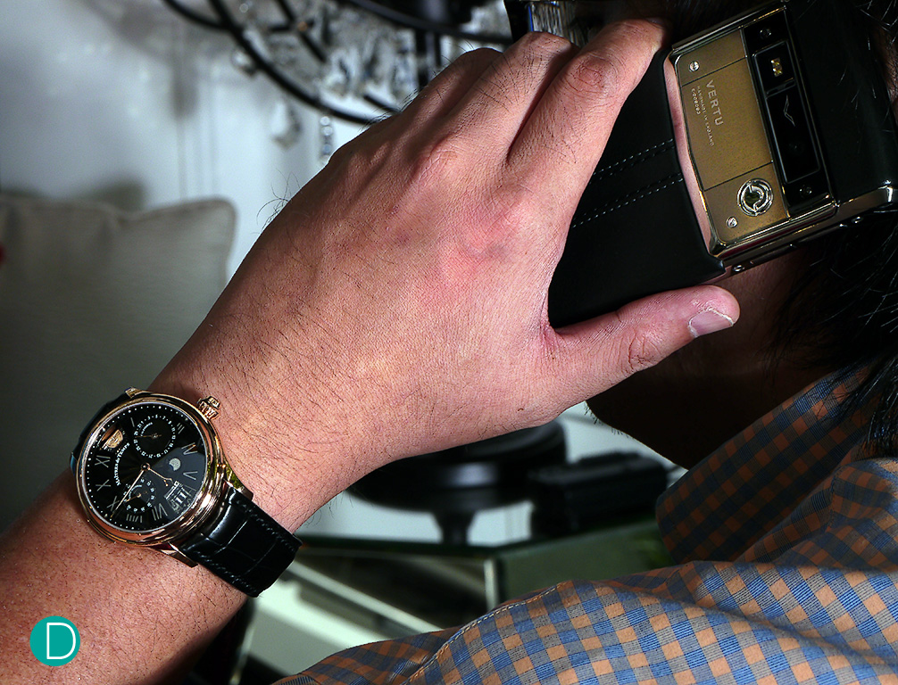 The wrist shot: Maîtres du Temps Chapter Three Reveal on its owner's wrist.