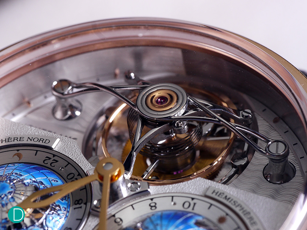 The tourbillon with a cylindrical hairspring and a very large balance wheel. The beautiful, arched curves of the tourbillon bridge is quite a spectacle.