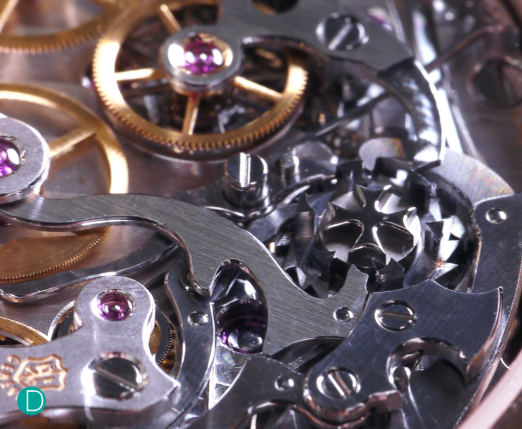 The chronograph works, showing the column wheel and the levers actuating the lateral clutch system of the chronograph. 