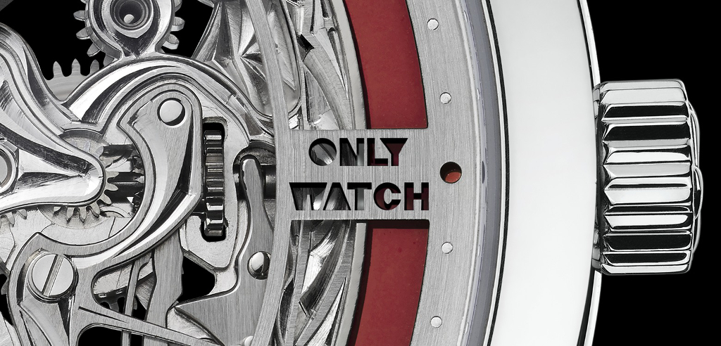 Detail on the case showing the special skeletonized plate show "Only Watch" and the red grand feu red enamel ring.