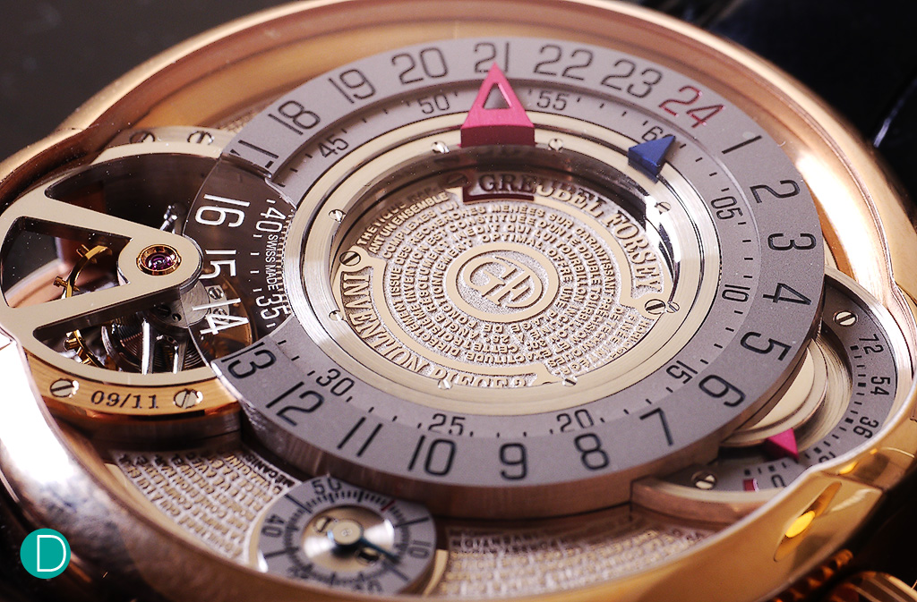 The dial in detail. An extract of a message from the inventors describing their creation and their philosophy is very finely engraved on four gold plates. The complete message can be viewed through the display back where it is engraved on a crescent-shaped plate.
