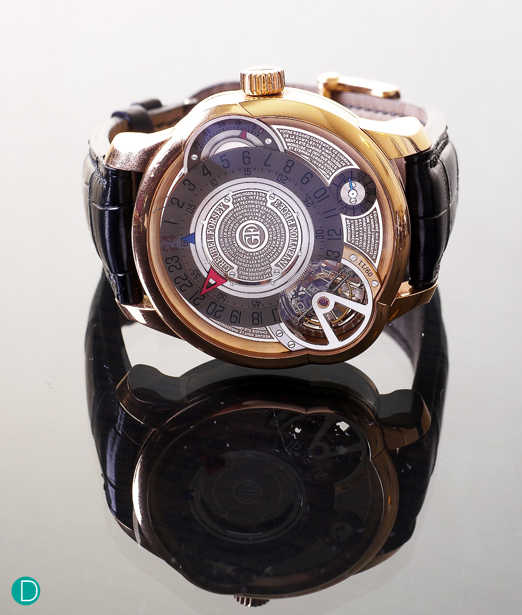 Greubel Forsey Invention Piece 3. The watch is rather more discrete than one would initially imagine with the unorthodox design of the dial, and the tourbillon sticking out as a buldge in the case side. A curved sapphire glass is placed on the buldge to allow the incline tourbillon to be visible from the side.