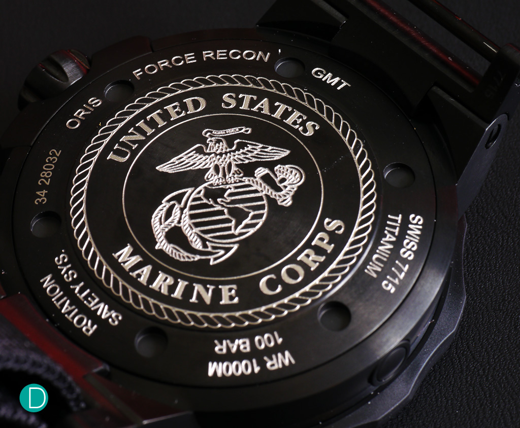 The caseback, engraved with the logo of the USMC.