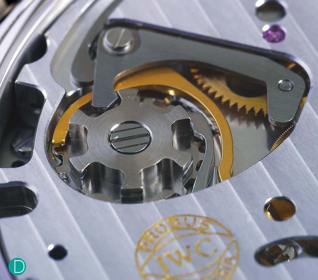 The column wheel, visible through an opening on the plate covering the chronograph works.