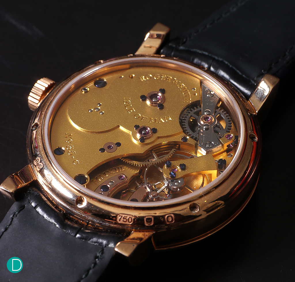 The movement is gilt finished and features the Daniels Coaxial escapement.