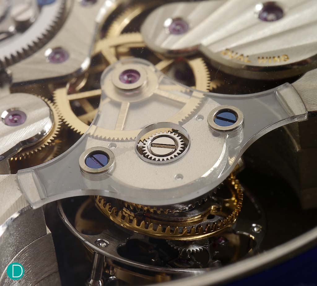 The drive system for the inclined spherical tourbillon. Note the engagement with the third wheel is on a level plane, and the teeth of the tourbillon carriage is at an incline. 