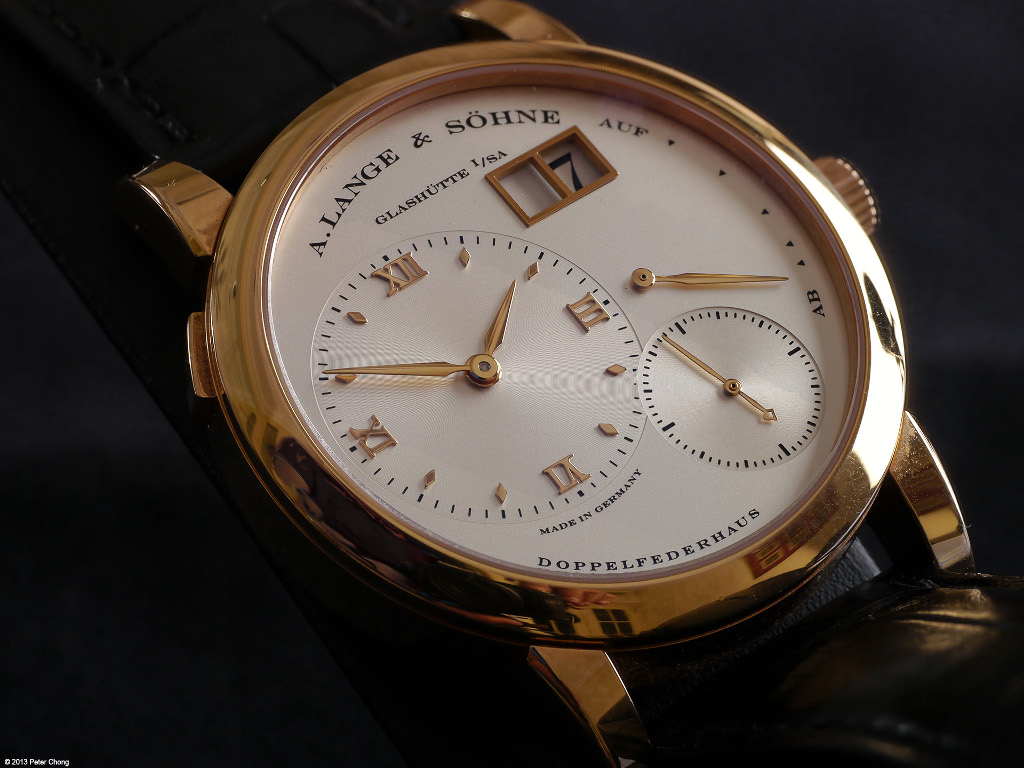 The Lange 1 is the iconic Lange, shown here in a pink gold case, and champagne dial. This version was introduced circa 1998, and was an addition to the original series introduced in 1994 which comprise of the yellow gold, white gold and platinum watches.