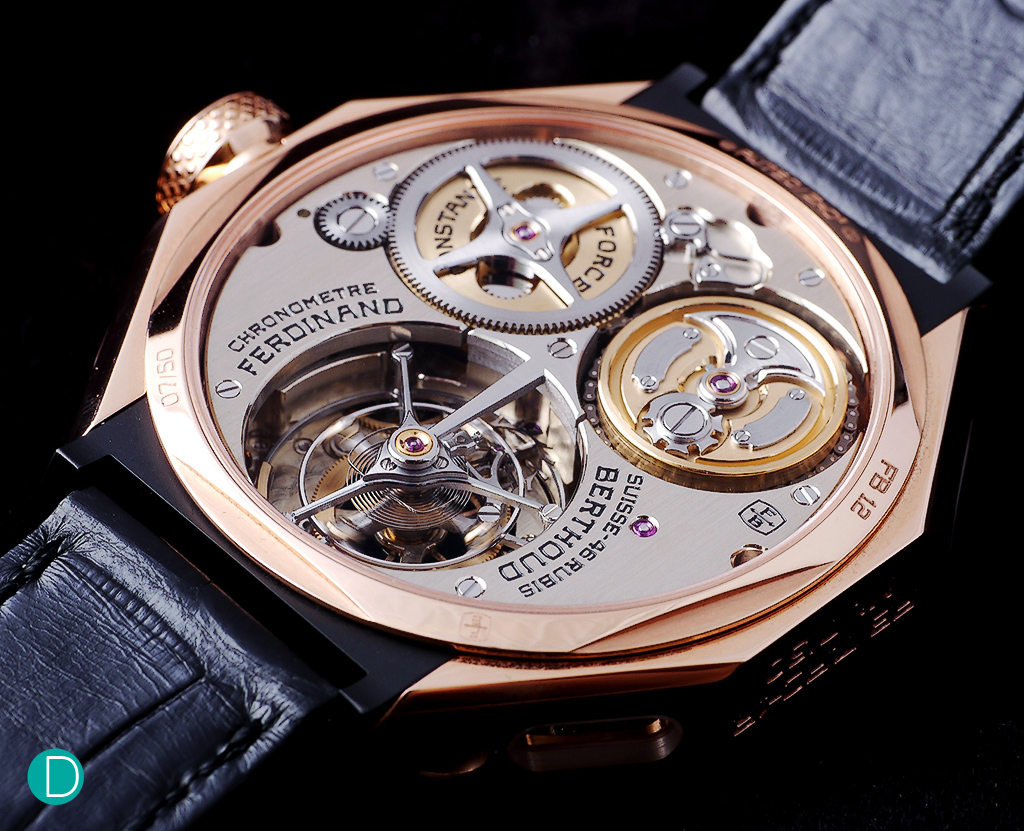 From the back, the fusée and chain system is visible, as well as the tourbillon with a very large cage, whose diameter is almost the radius of the case.