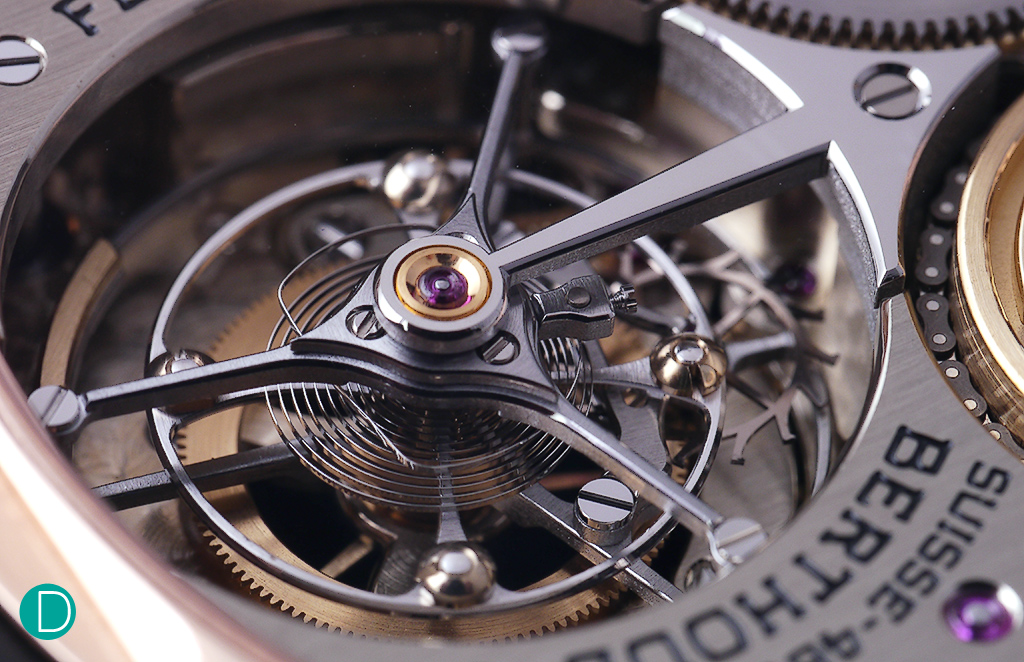 The very large tourbillon cage measuring 16.55 mm beating at 21,600bph. The tourbillon makes one revolution every minute. Finishing is immaculate, and absolutely first grade. Note the fine polishing on the titanium cage, and the single arm bridge. Also note the 18kt gold studs which are used for poising is also beautifully polished.