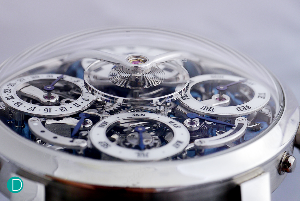 The signature suspended balance which seems to be unconnected to the rest of the movement train is a signature of the LM series. As are the subdials which appear to float above the dial. 