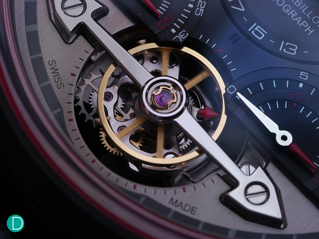 The small minute tourbillon cage is the centre piece of the dial, seen here with nicely chamfered bridges.