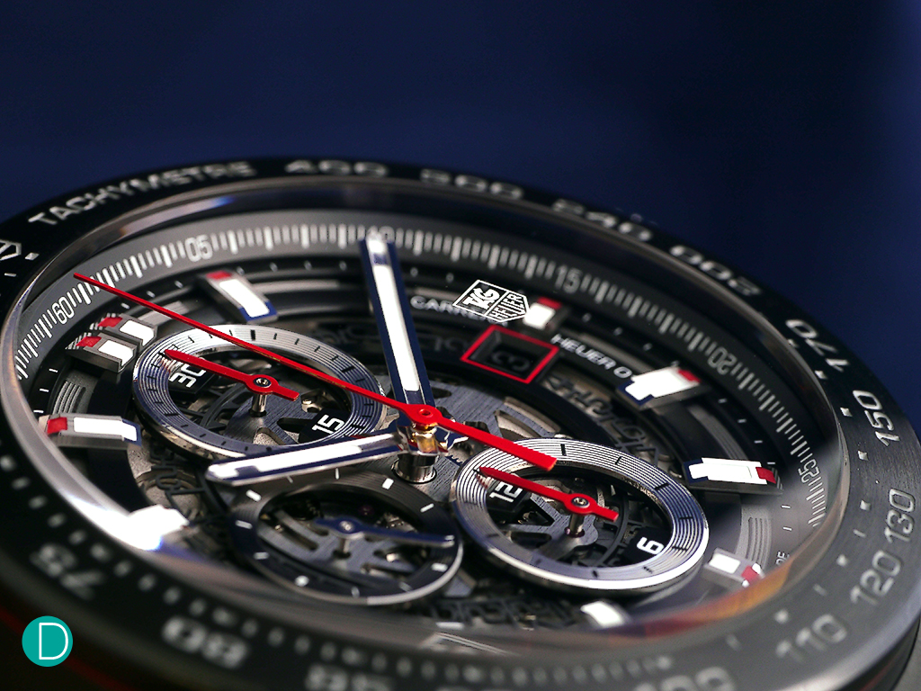 Dial of the TAG Heuer Carrera Heuer 01 chronograph. The play of black, white and red elements make it a very attractive dial.