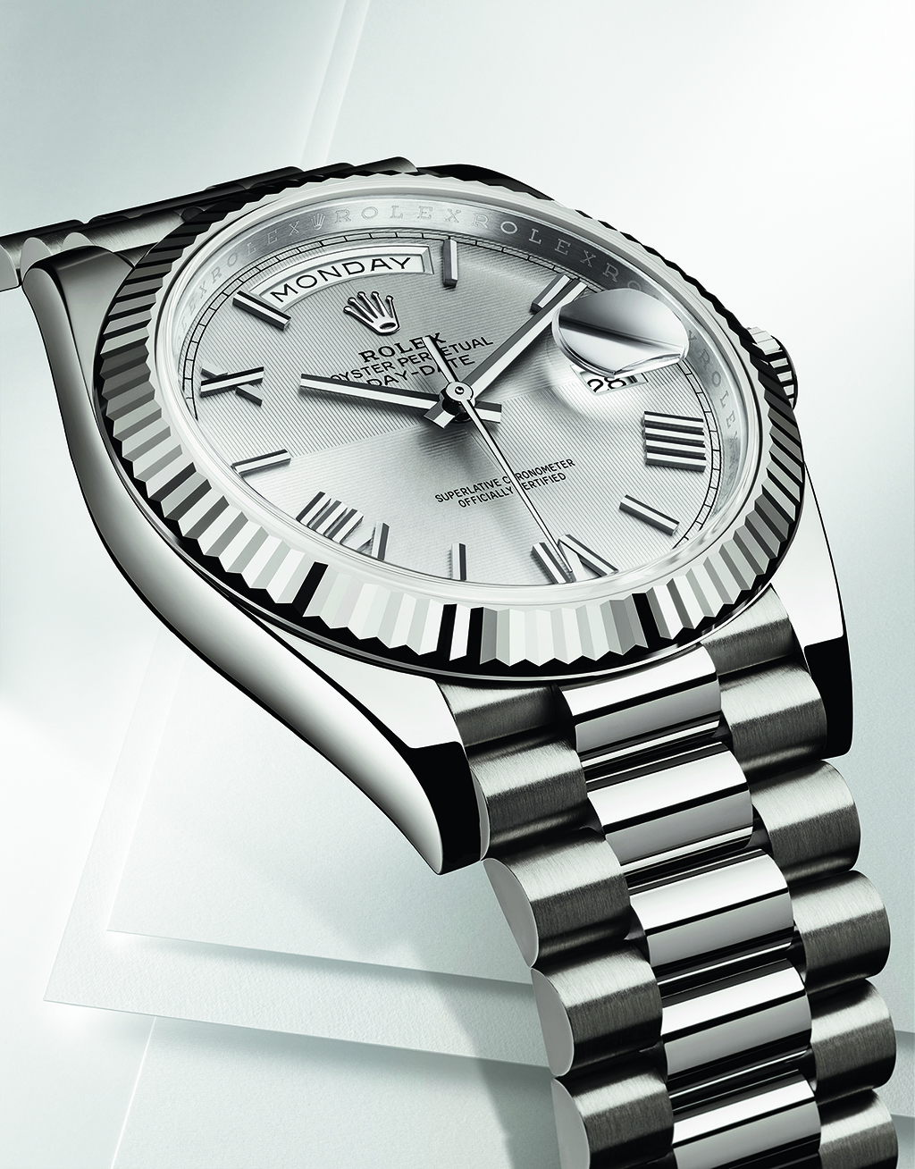 Rolex Oyster Perpetual Day-Date 40 in white gold and silver dial with a quadrant motif on sunray finish