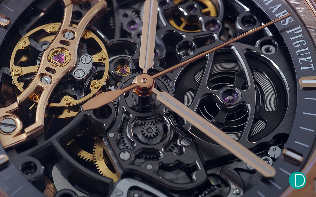 The dial is a fusion of contrasting colours, pink gold hands and bridges with yellow gold coloured double balance wheel and darkened metal on the bridges.