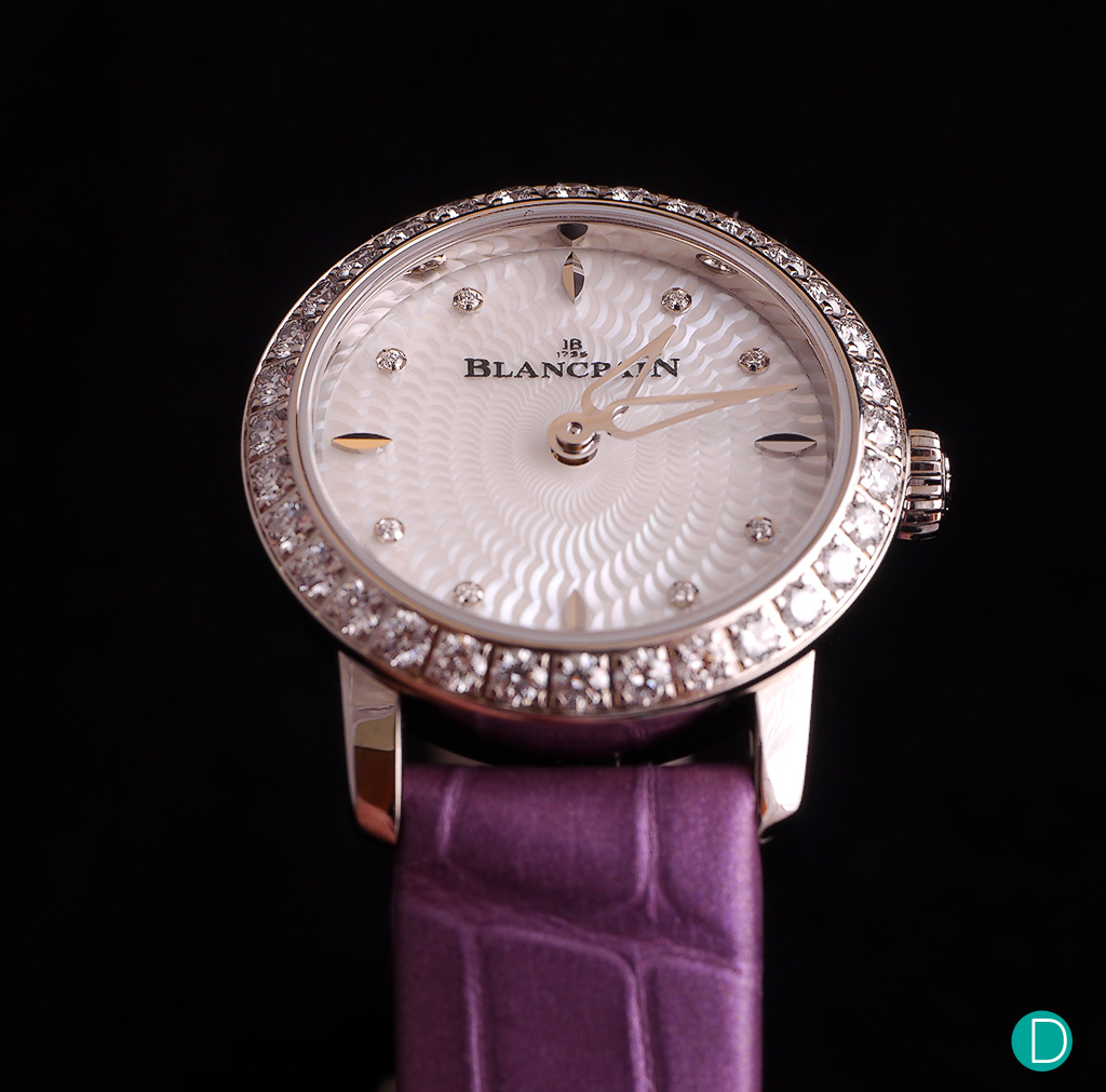 This limited edition come in a white gold case and features a bezel set with a row of 32 diamonds.