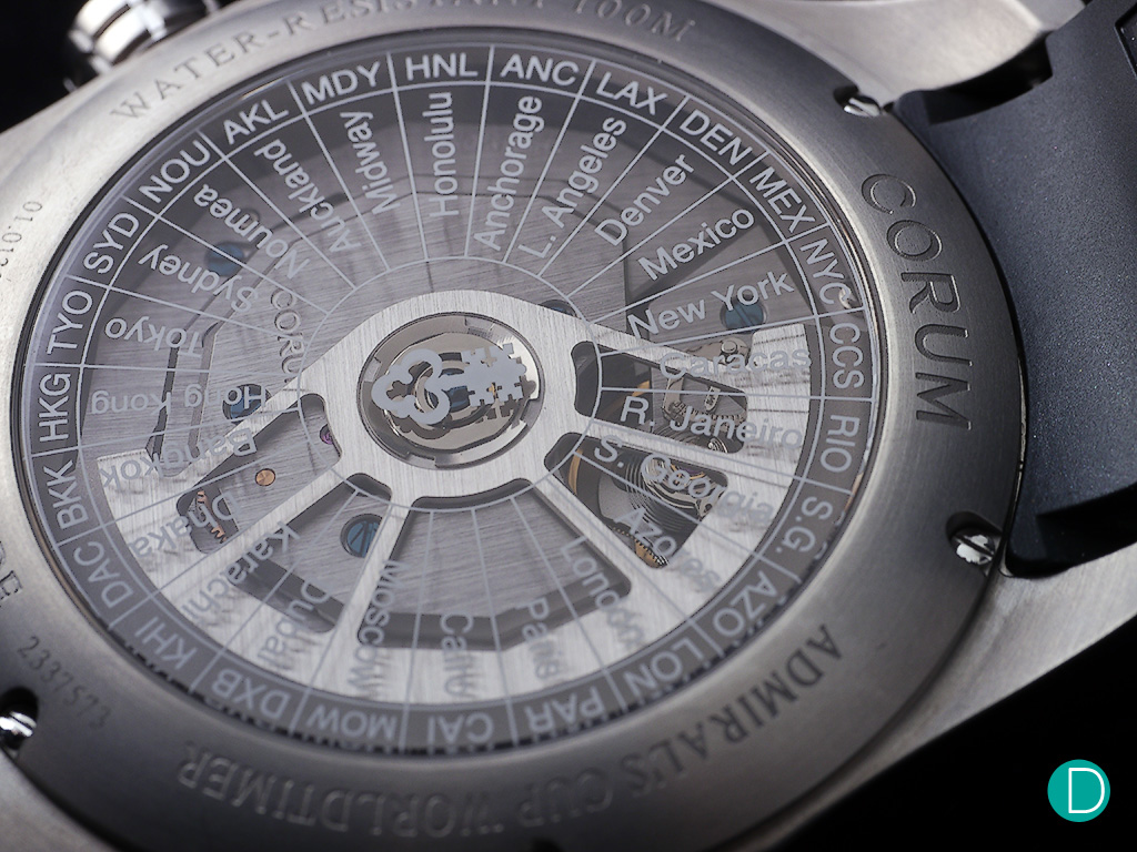 The open bottom of the dial is equipped with smoked sapphire crystal engraved with the names of cities in 24 different time zones
