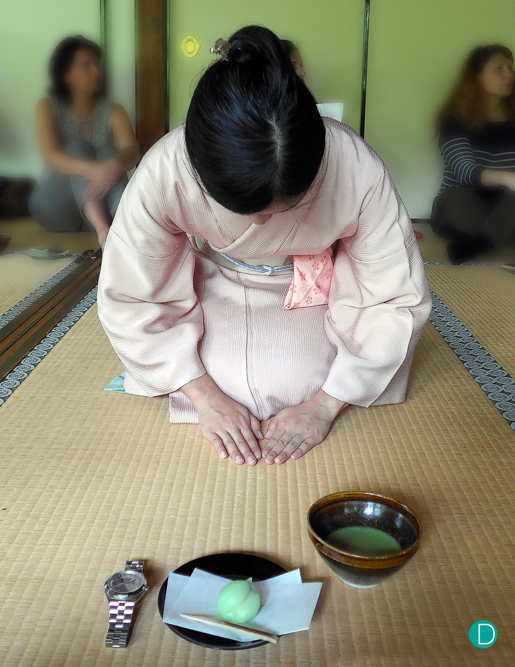 Tea is served. Traditional Japanese style. Note that during the ceremony, it is common for one to remove one's watch to denote that one is not encumbered by the burdens of life, and ready to partake of the spiritual experience. Tea is served with a small sweet cake.