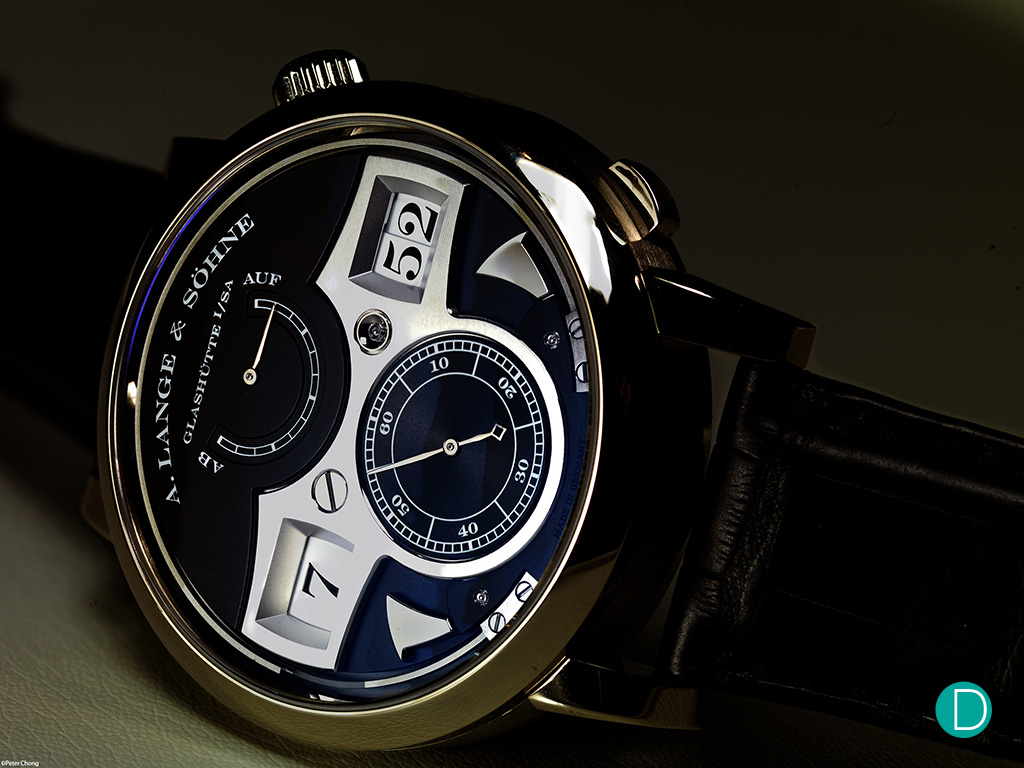 The Lange Zeitwerk Striking Time in whote gold, black dial The dial can appear to be blue under certain lighting conditions, due to the anti-reflection coating on the sapphire glass. 