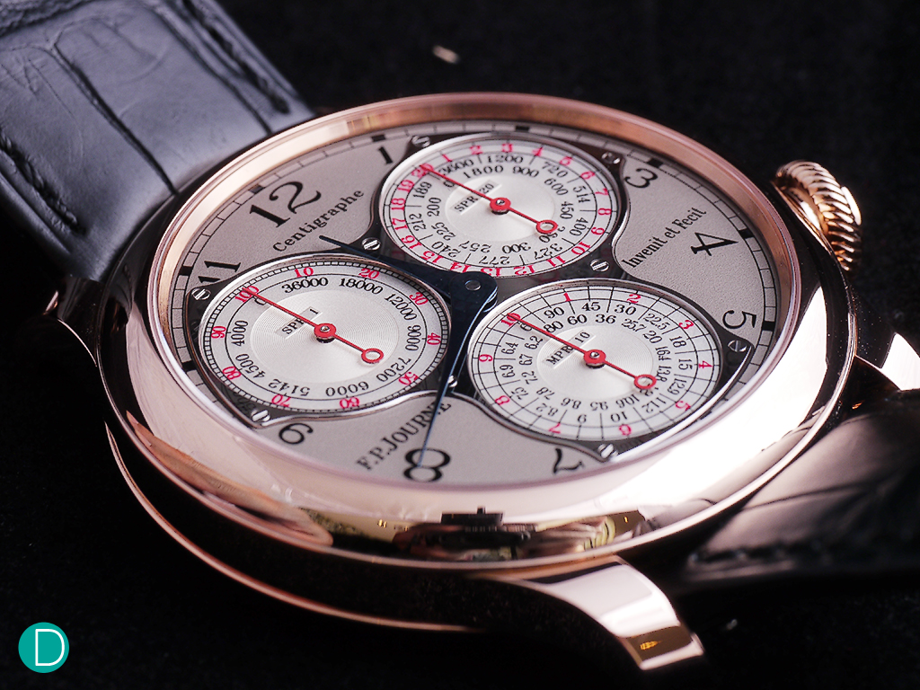 The Centigraphe sports three beautifully-designed sub dials that indicates elapsed times from a 100th of a second to 10 minutes. Each sub dial has a time scale in red and a tachometer scale in black.