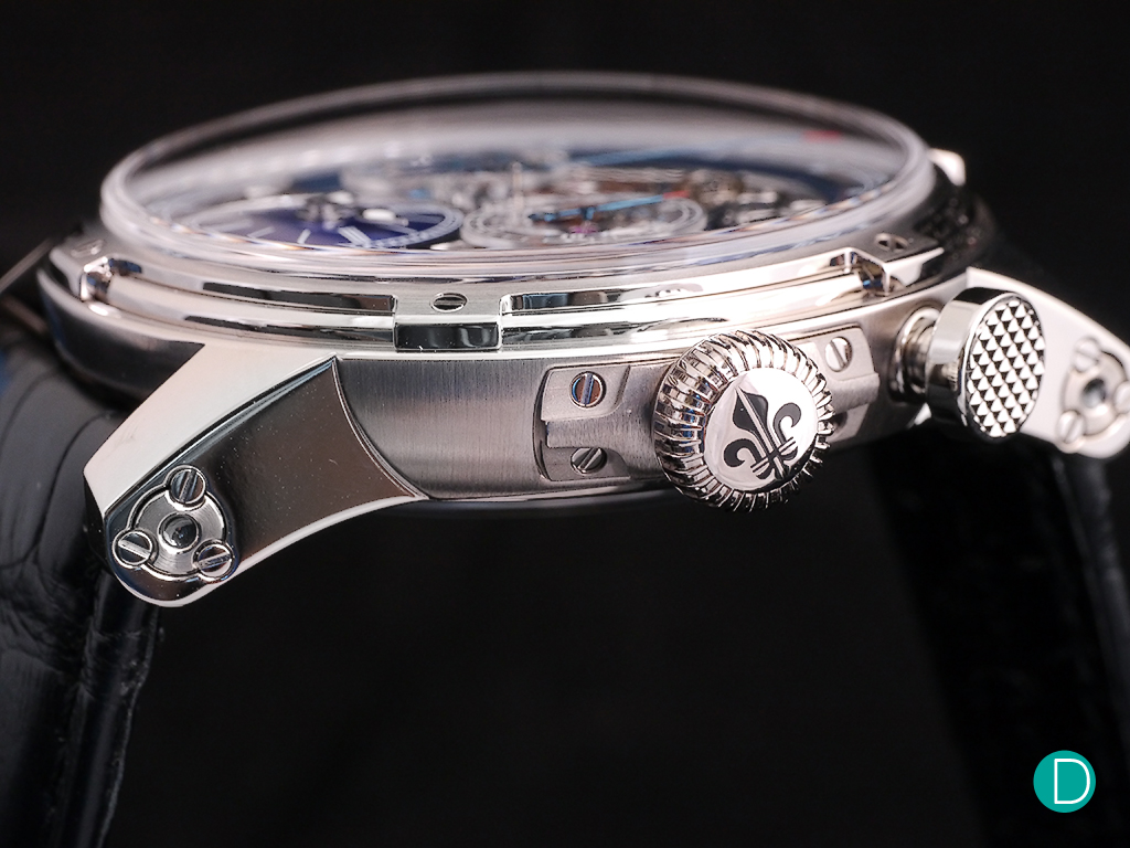 The crown is engraved with the Fleur de Lys, the symbol adopted by Louis Moinet as their logo. And the monopusher button is decorated with a Clous de Paris motif.