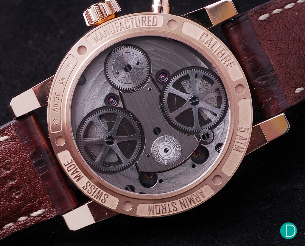 The caseback shows the twin barrels and the dual train. 
