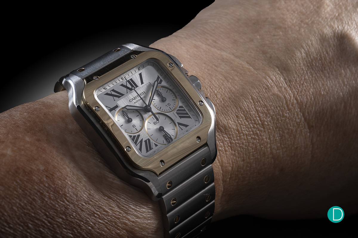 Cartier Santos on the wrist showing the integrated bracelet and blued sword hands